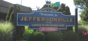 Large welcome sign for Jeffersonville, Indiana, reading "Welcome to Jeffersonville, established 1802, Gateway to the Hoosier State." An additional, smaller sign reads "Home of the Jeff Red Devils."