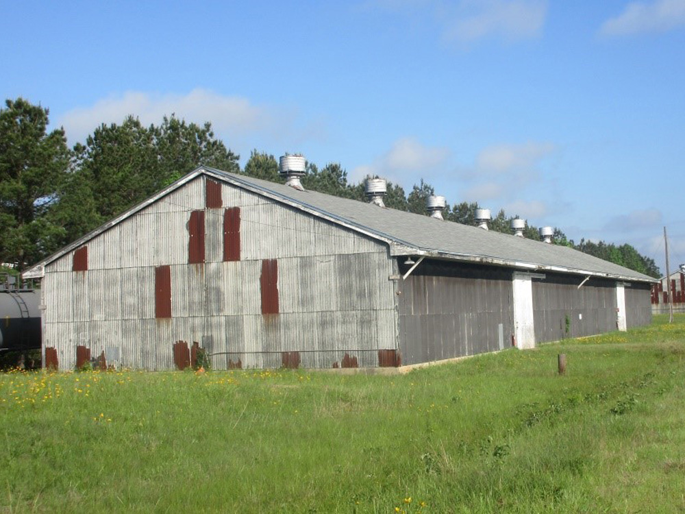 Historic barn with corrugated metal and wood siding.