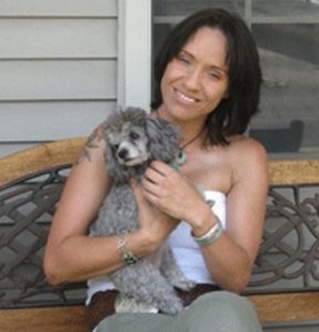 Karen pictured with puppy.