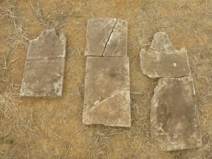 Rectangular stone artifacts discovered at the site.