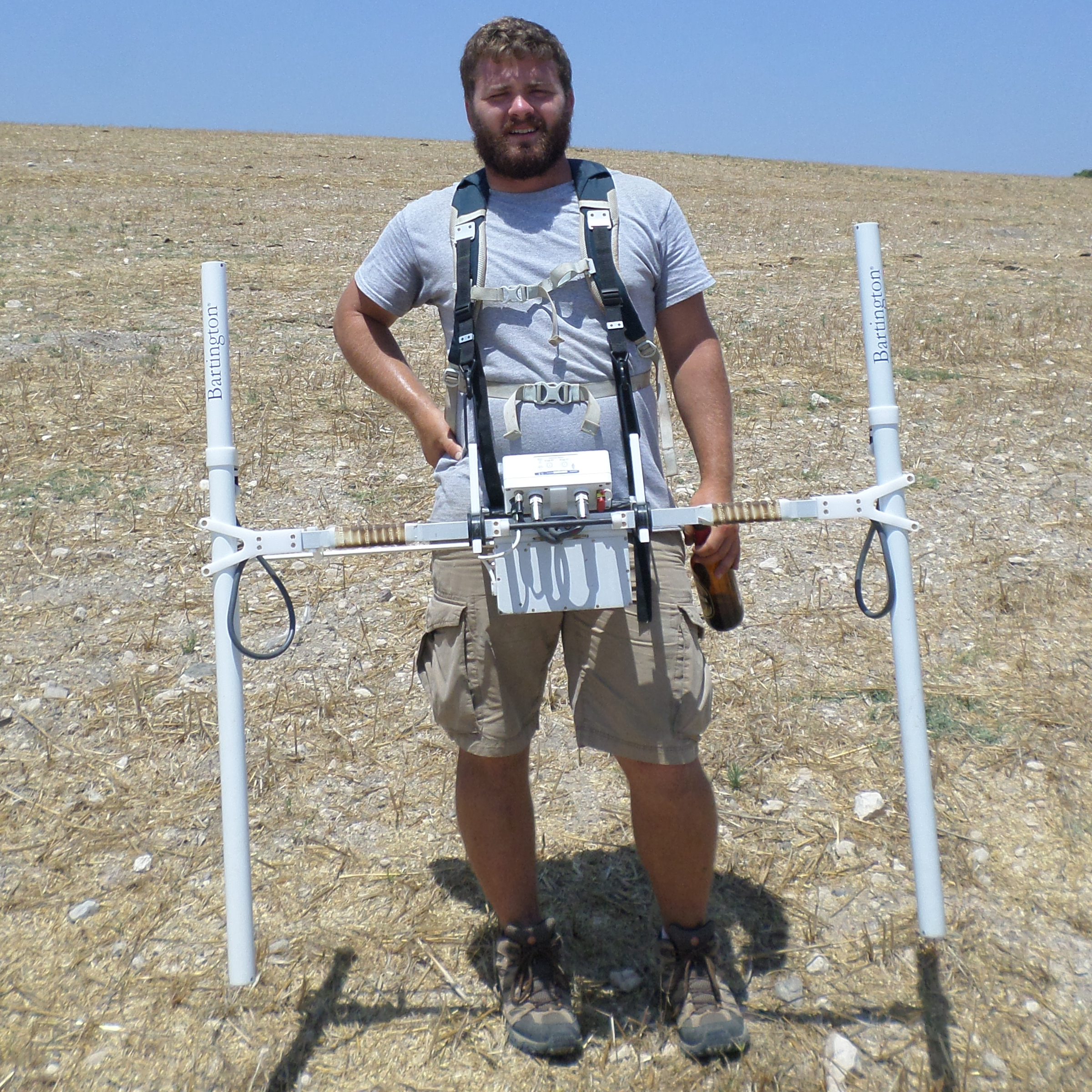 Jeremy standing in open field with GPR equipment.