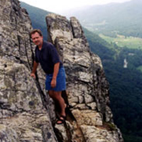 Mike standing on rocky mountainside.