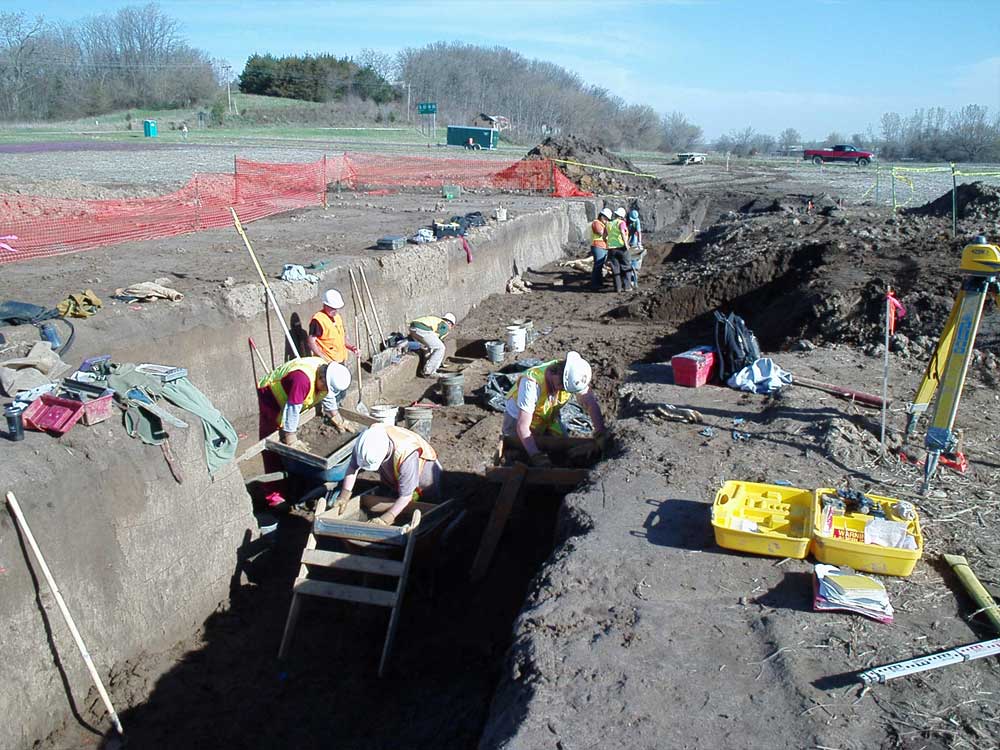 CRA crew working inside an expansive trench.