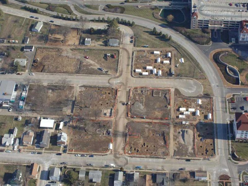 Aerial view of the project area, several squared lots separated by roadways.