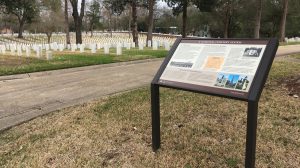 Infographic, with heading "A National Cemetery System," shown with military headstones in background.