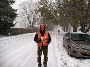 John pictured on snow-covered road.