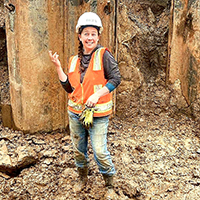 Lisa standing in excavated area.