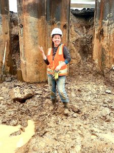 Lisa standing in excavation area.